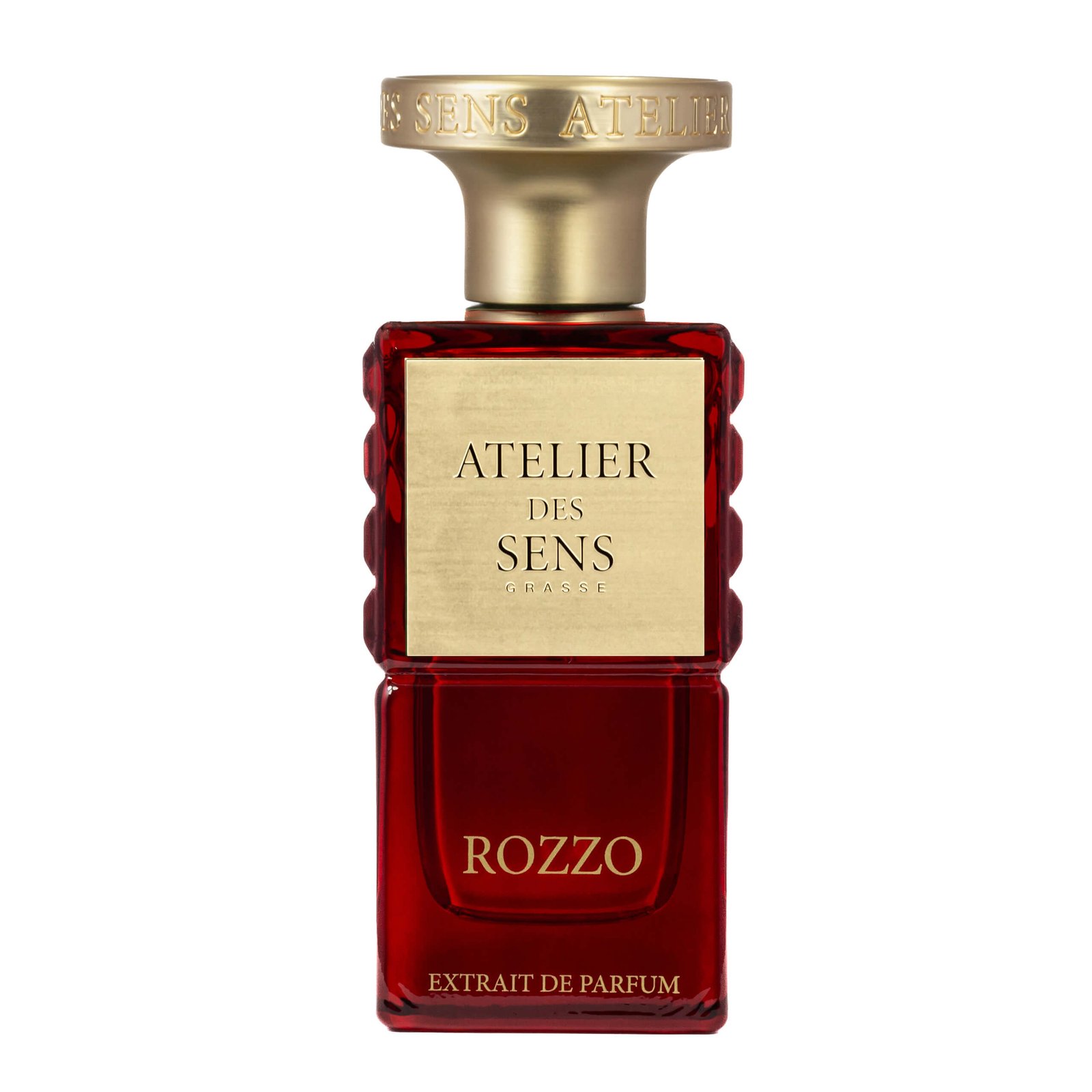 an extrait de parfum bottle of perfume in a red background